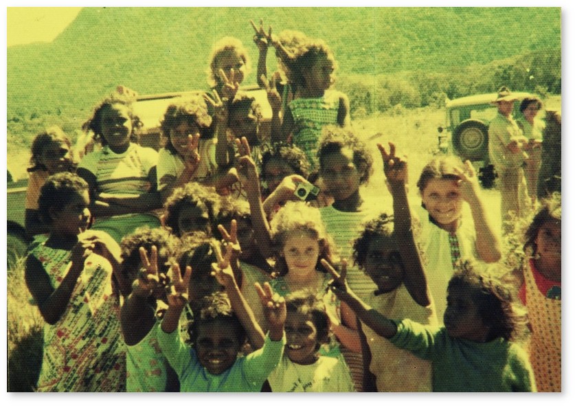 Children from Bloomfield River region waving to the camera