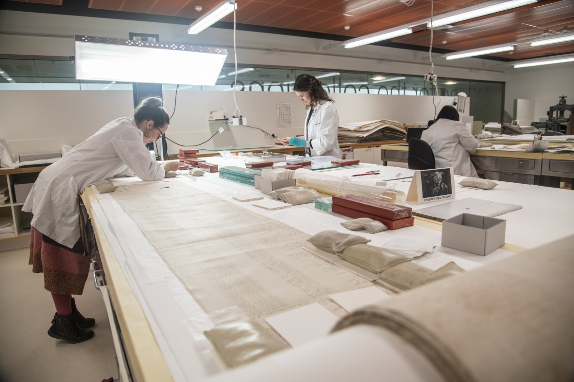 Conversator treating a fragile scroll of paper
