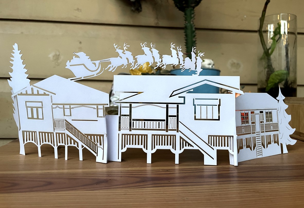 Image of a paper cut diorama of Queenslander houses