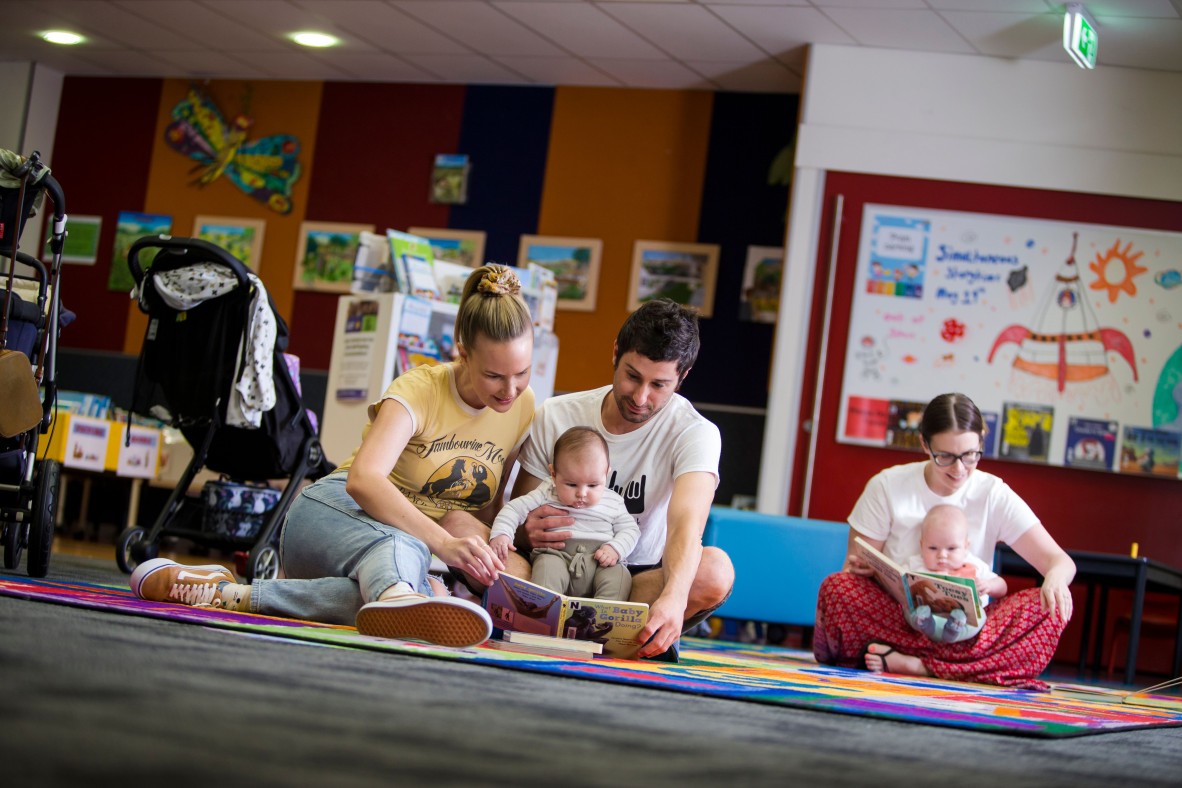 Parents and babies play and reading session at Logan Library