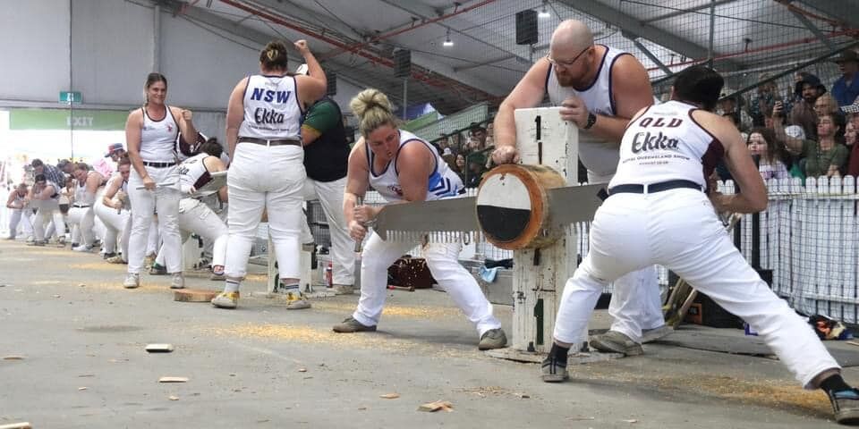 Anne Paterson & Madeleine (on the left hand side) winning the Jill and Jill Double Handed Sawing event Ekka 2022.