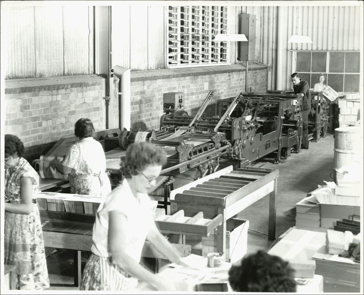 Employees working on the Staude Carton Gluer, QCC, Moorooka factory, 1955. 