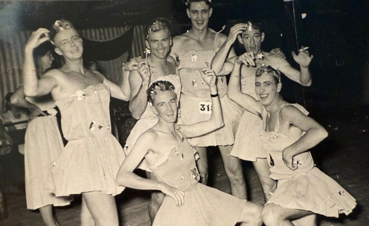 Men in fancy dress, cross-dressing, on a cruise ship.