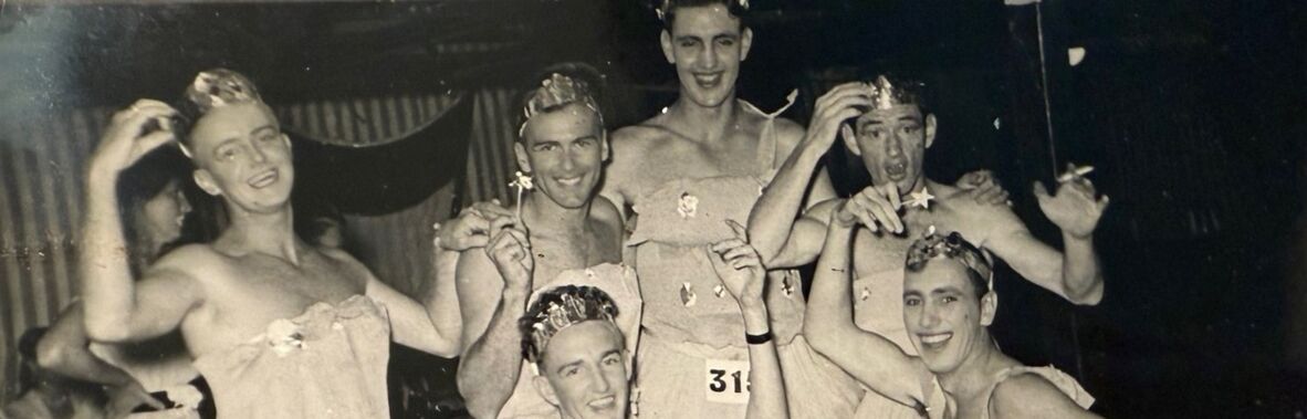 Men in fancy dress, cross-dressing, on a cruise ship.