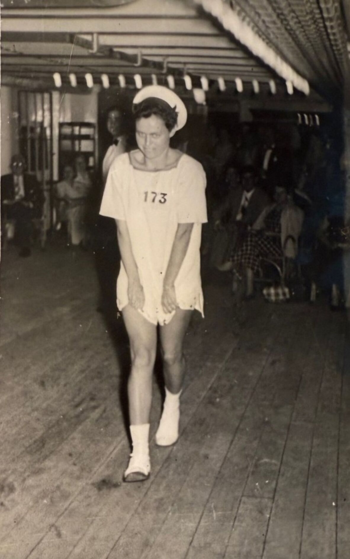 Men in fancy dress, cross-dressing, on a cruise ship.
