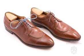 Blücher is a style of shoe with open lacing, its vamp made of a single piece of leather ("one cut"), with shoelace eyelets tabs sewn on top.
