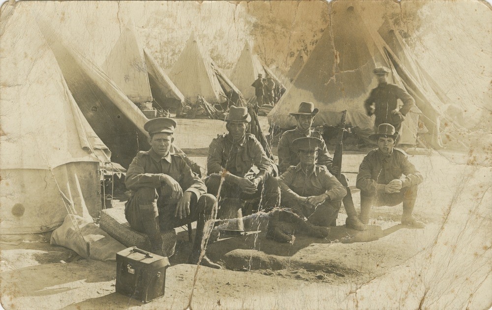Private Alfred Powell (seated far right) with other soldiers from the 26th Australian Infantry Battalion at the Enoggera training camp, Brisbane, 1915.