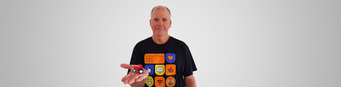 RDDO Rick Hospers holds up a 3D printed toy tractor