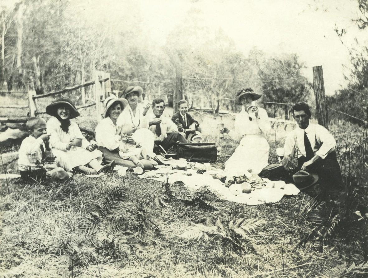 A group of people having a picnic in the bush