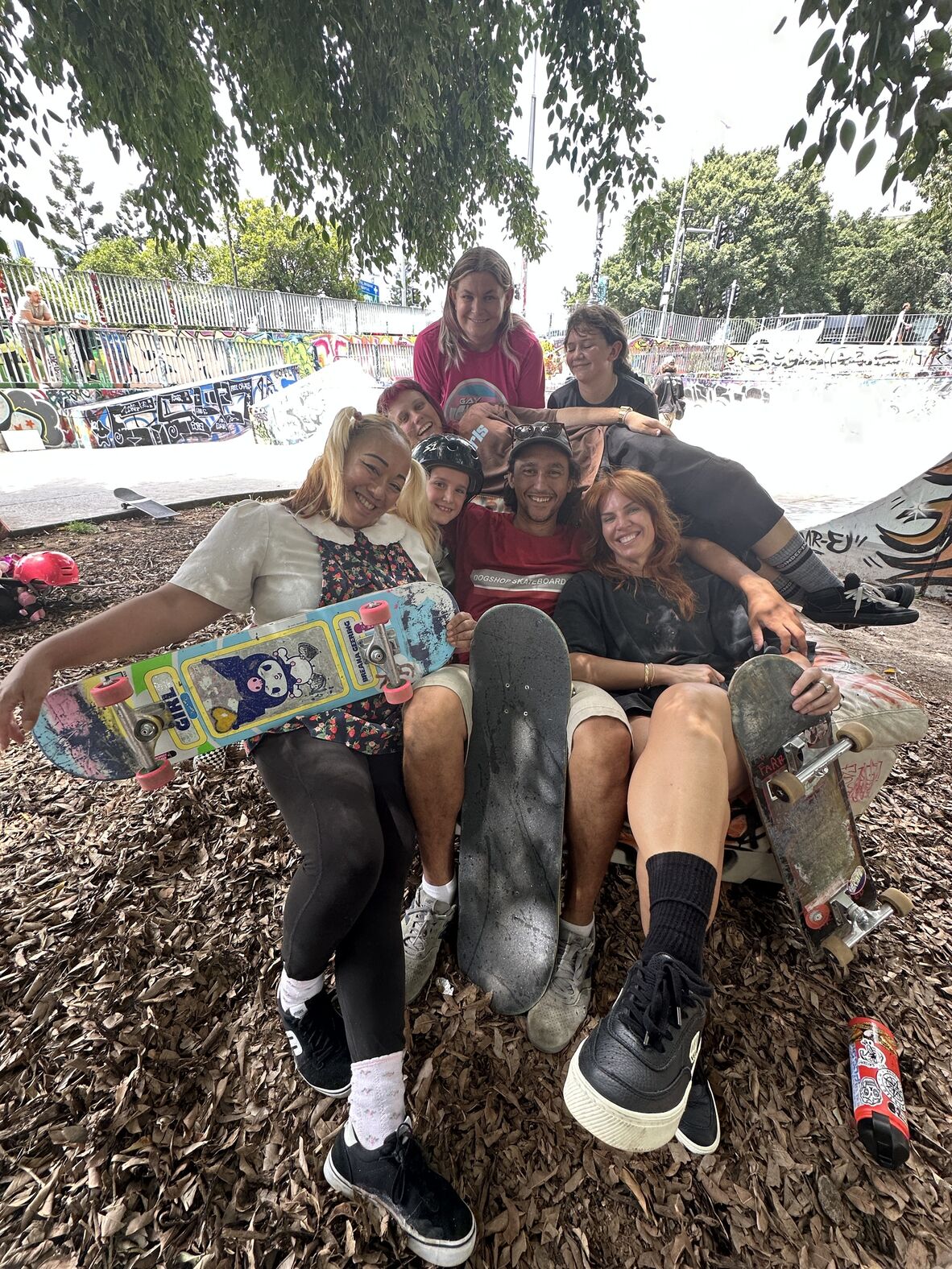 Seven skaters posing for a photograph