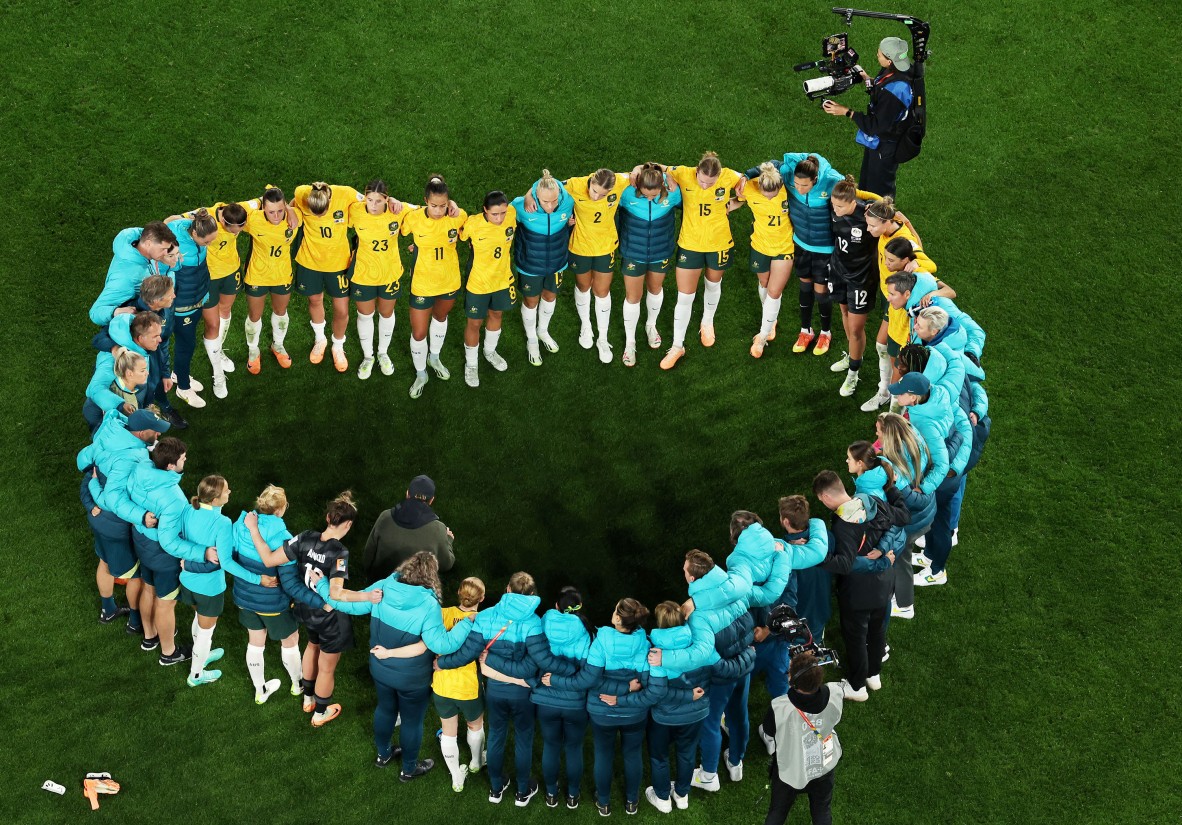 A photo of the Matildas forming a heart shape on the field
