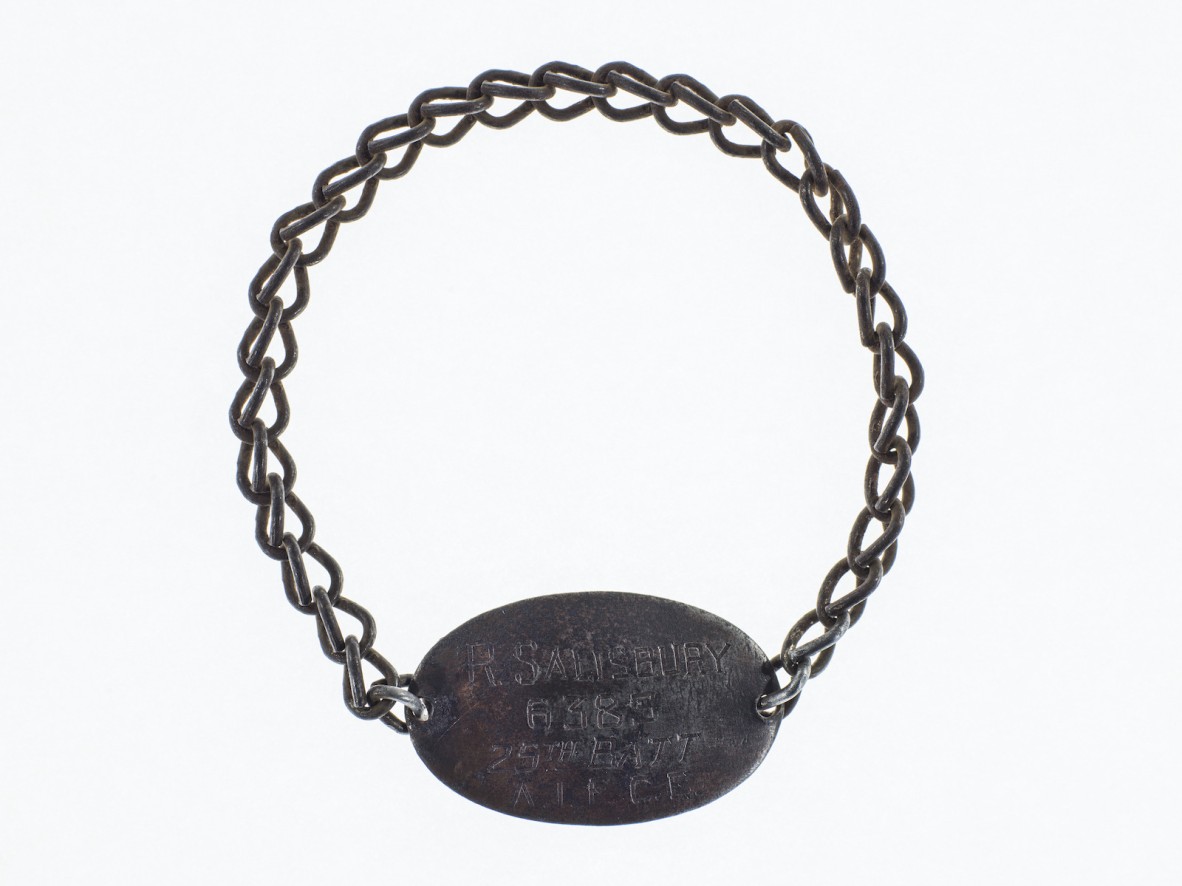 An identity bracelet that reads 'R. SALISBURY 6385 25TH BATT A.I.F. C.E.'