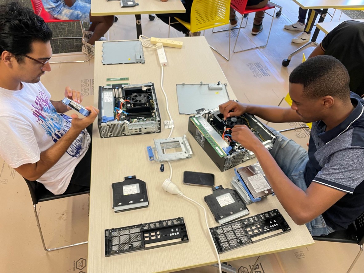 2 young men working on computers