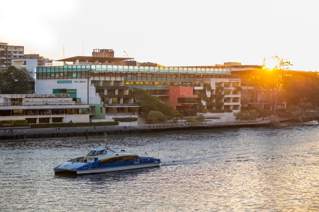 Image of the State Library of Queensland building at sunset