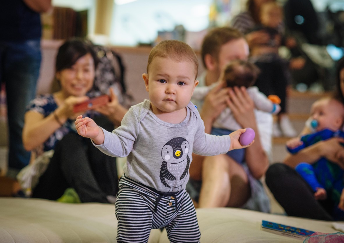 Baby in penguin top dancing at Rhyme Time