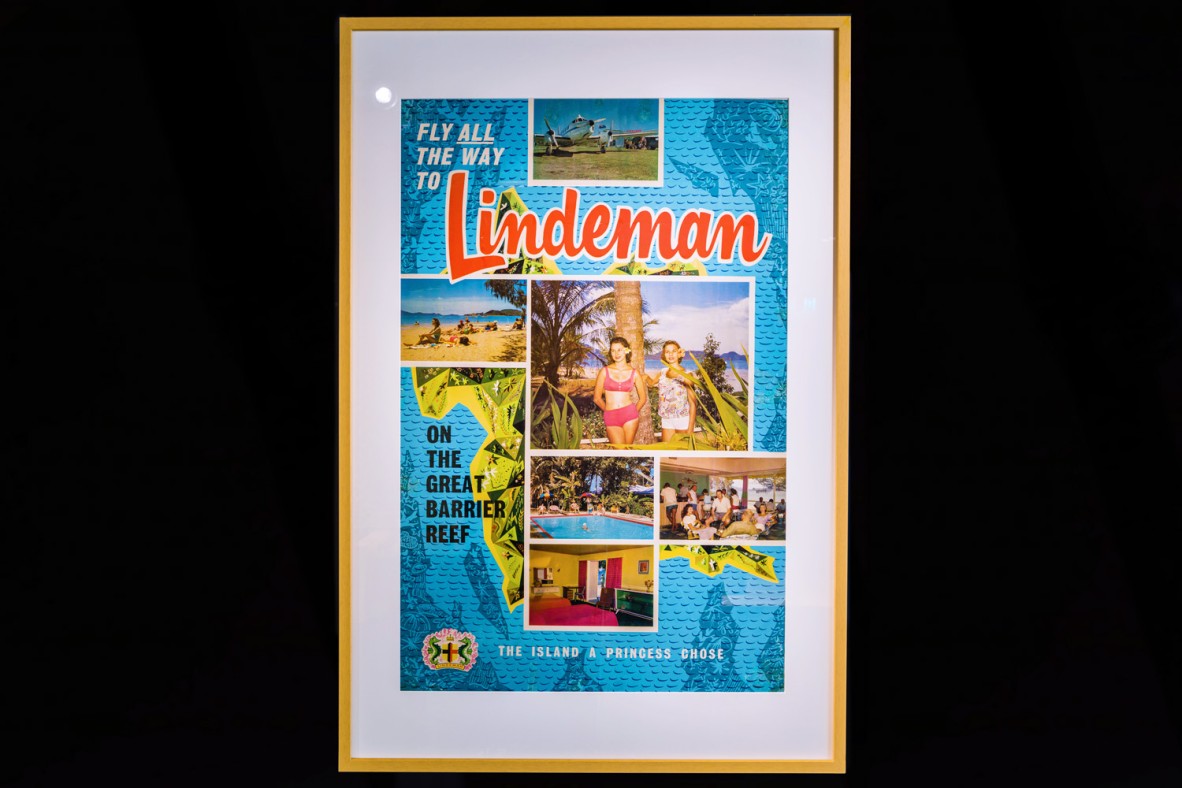 Framed poster advertising tourism to Lindeman Island