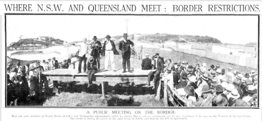 A photo of residents meeting on the New South Wales-Queensland border to discuss quarantine