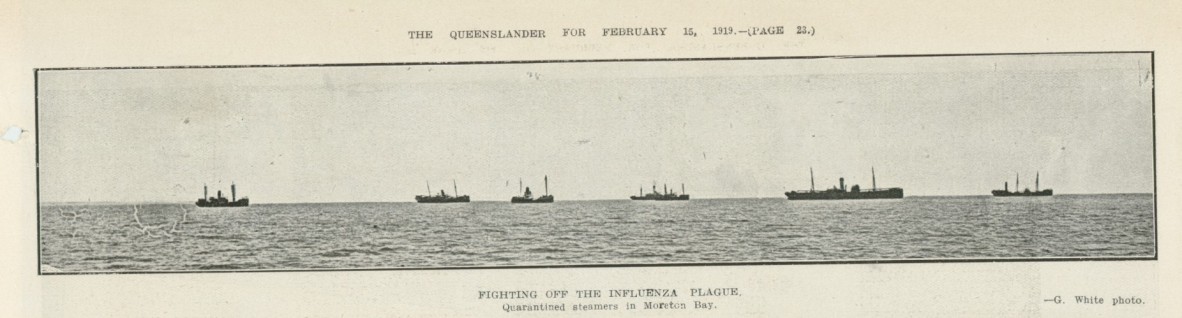 Black and white photo of six ships on the horizon