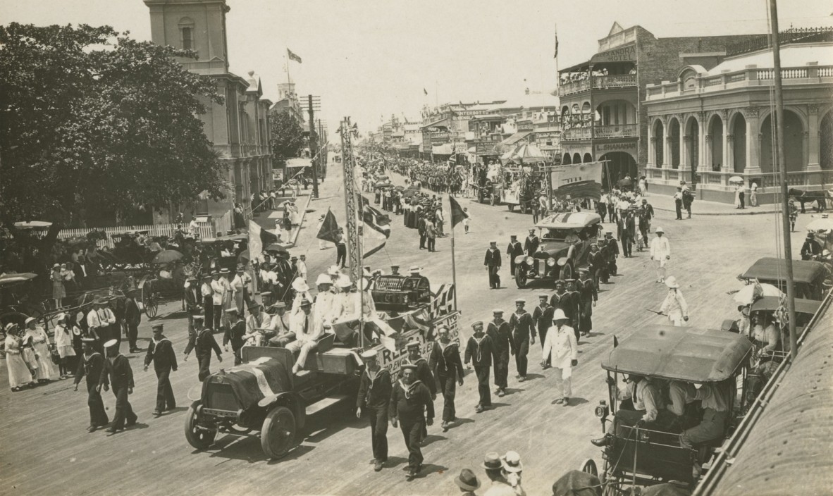 Sailors marching in an Armistice Day peace procession in Flinders Street, Townsville, Queensland, 1918