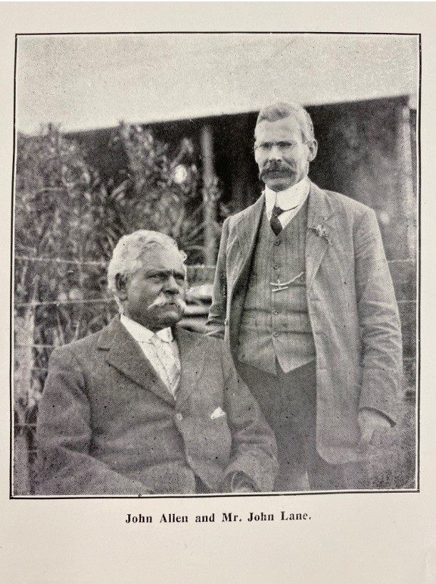 Photograph of two men John Allen seated and John Lane standing beside him