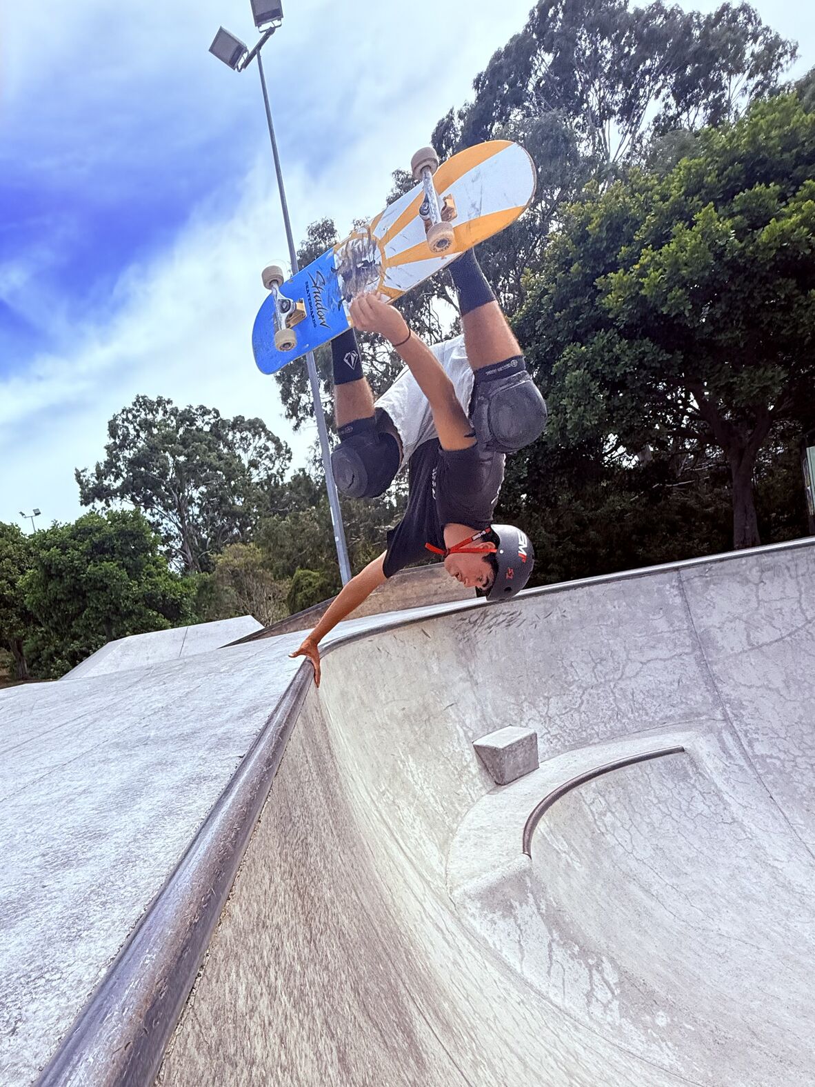 Skateboarder doing a handplant