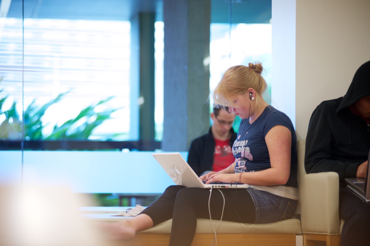 Girl using laptop in the Infozone