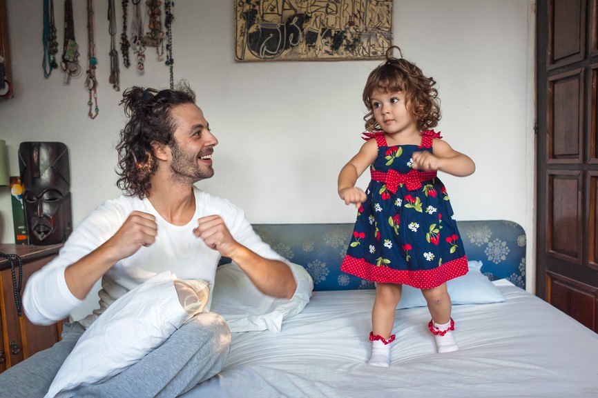 Dad singing and dancing with daughter