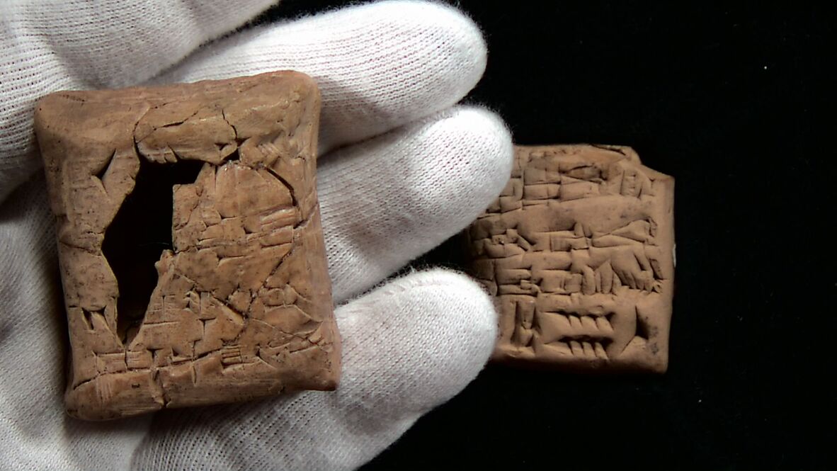 Ancient Sumerian tablet and envelope