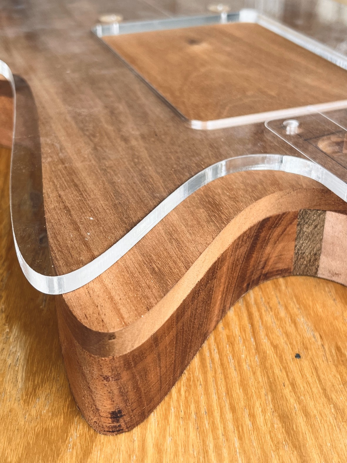 A photo of laser cut acrylic for making guitar parts