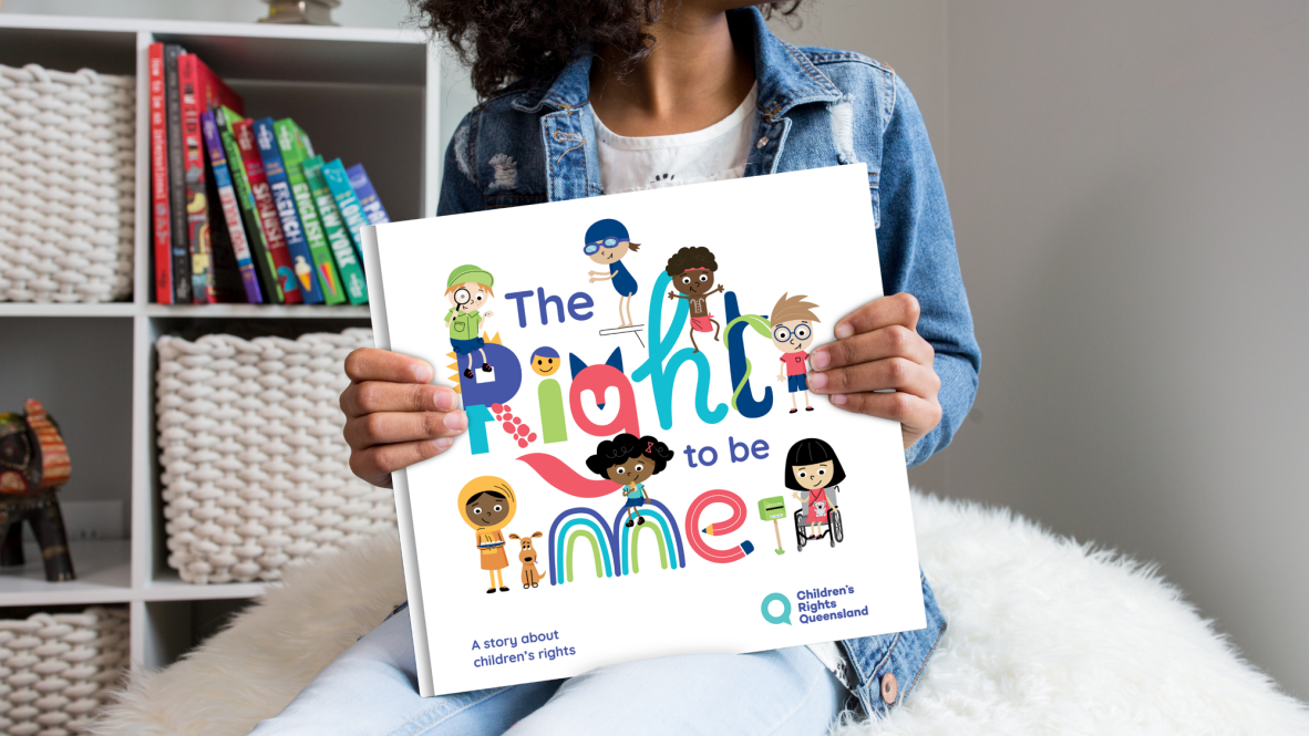 The Right to Be Me picture book held by child