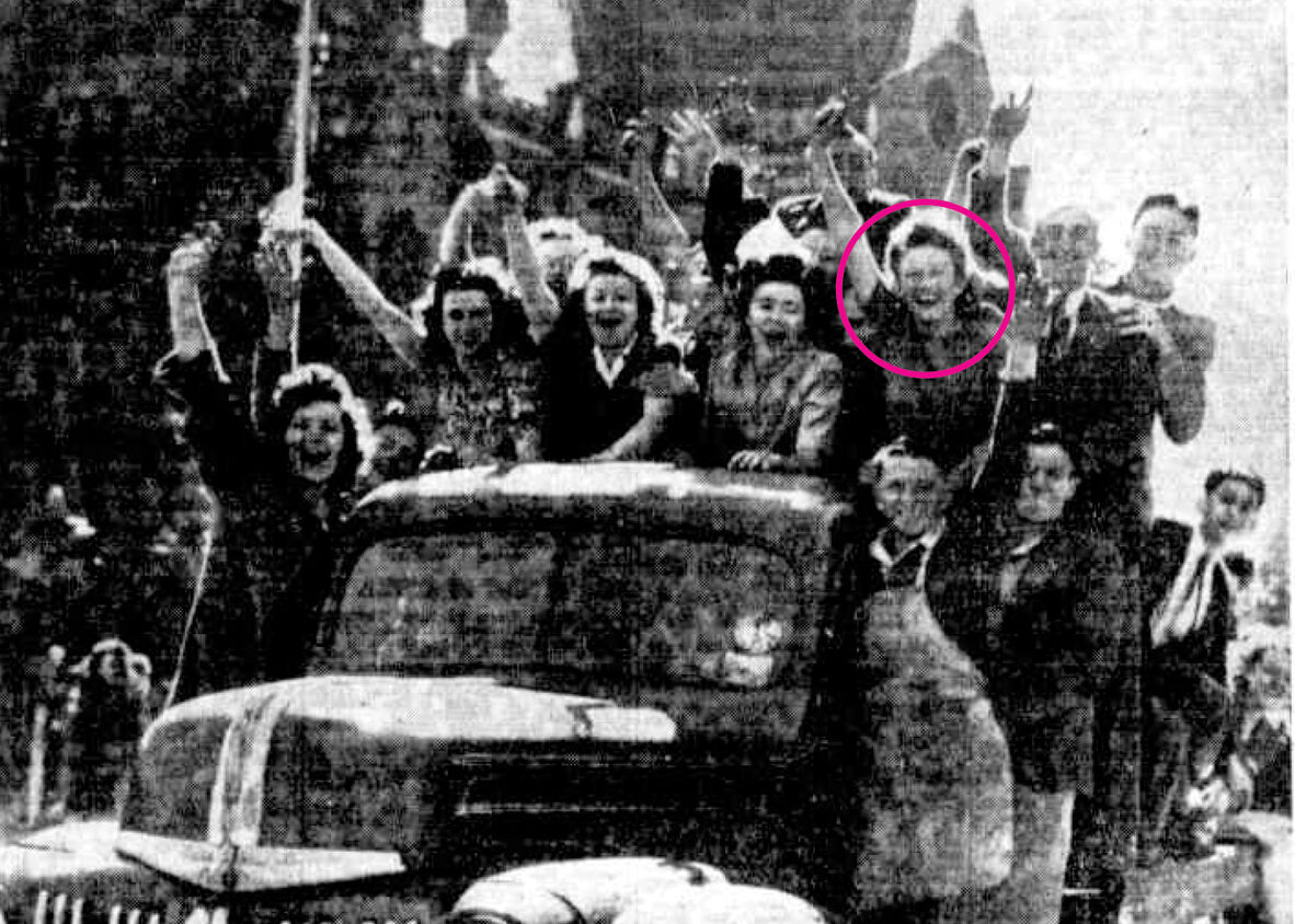 News clipping of excited people crammed on the back of a truck waving to crowd during parade