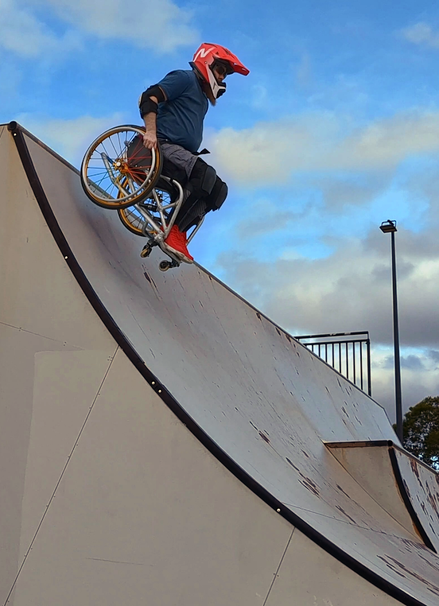 Timothy Lachlan in a wheelchair on a skater ramp