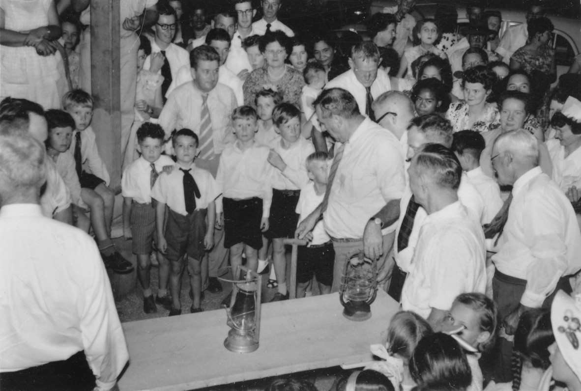 children stand around to celebrate electricity being turned on 