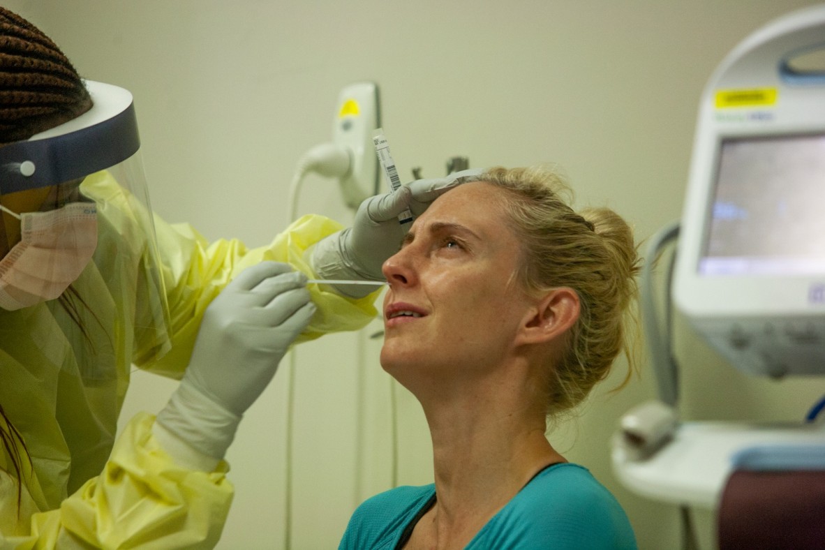 Nurse Nothabo Mbambo performing a nasal swab on patient Sarah Roettgers Princess Alexandra Hospital Brisbane 7 April 2020