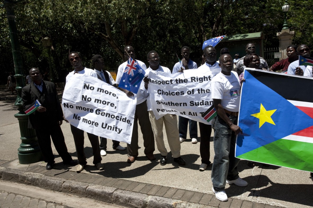 Demonstrators carrying signs relating to the South Sudanese independence referendum in Brisbane, December 2010