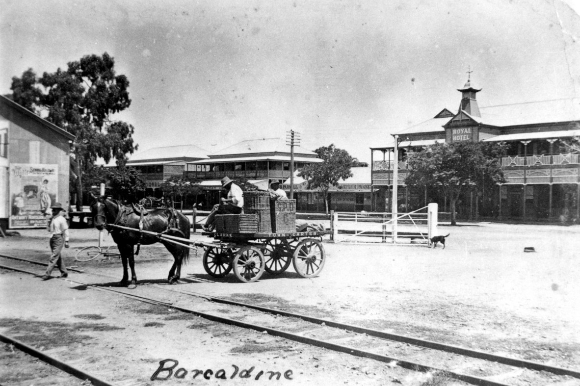 Horse drawn cart crossing the railway line in Barcaldine 1916 showing the Tree of Knowledge on the left in background