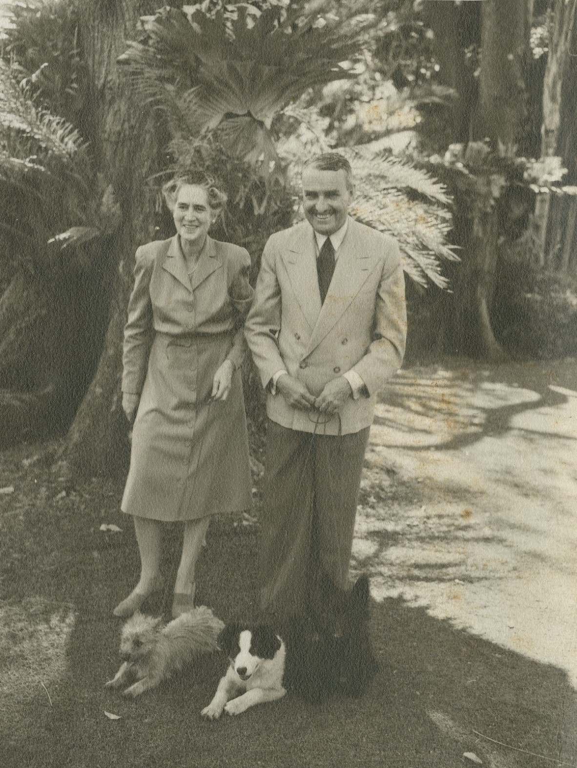 Sir John and Lady Lavarck walking their dogs in the grounds of Government House Brisbane