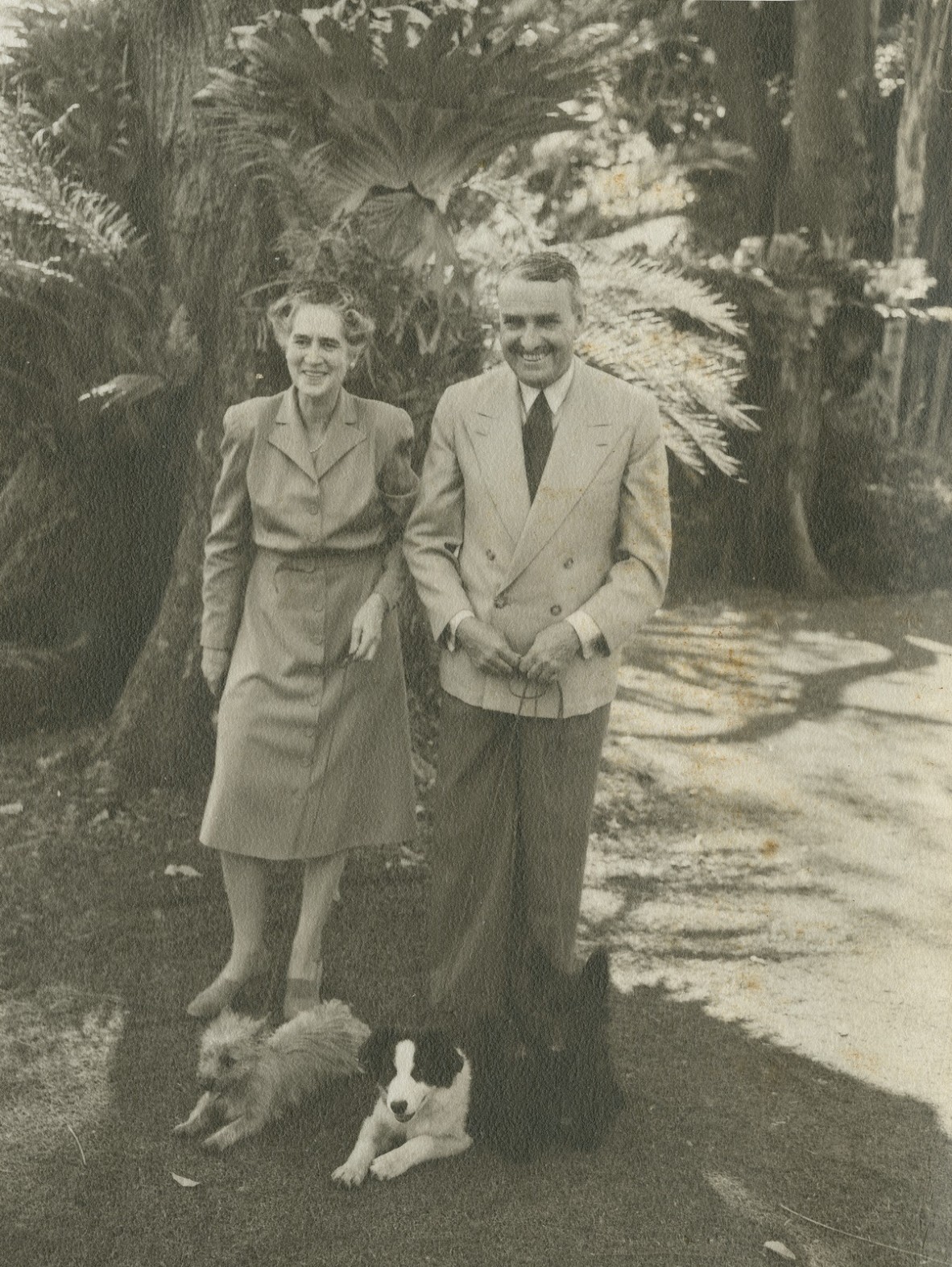 Sir John and Lady Lavarck walking their dogs in the grounds of Government House, Brisbane