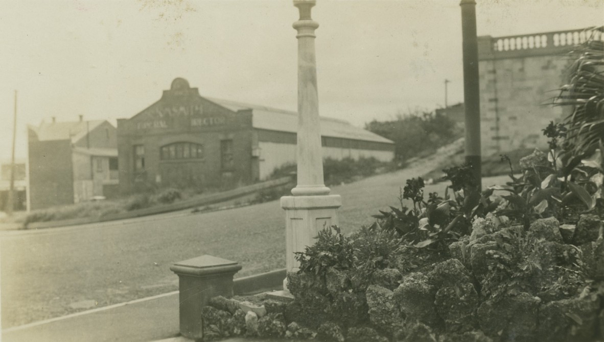 Looking from Centenary Place across Gotha St, Fortitude Valley. The building in the background is K.M. Smith Funeral Directors. The retaining wall on the right was part of the planned, but never-built Holy Name Cathedral. Wickham Street is to the far left.