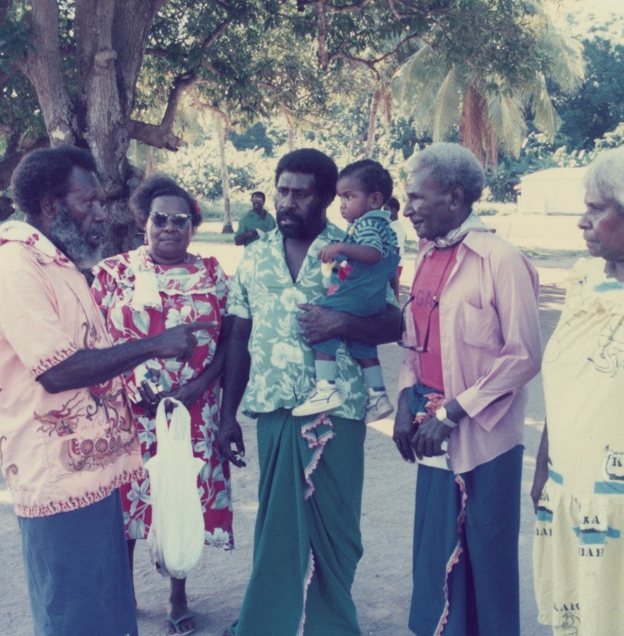 A group of torres strait islander people wearing colourful and floral clothing