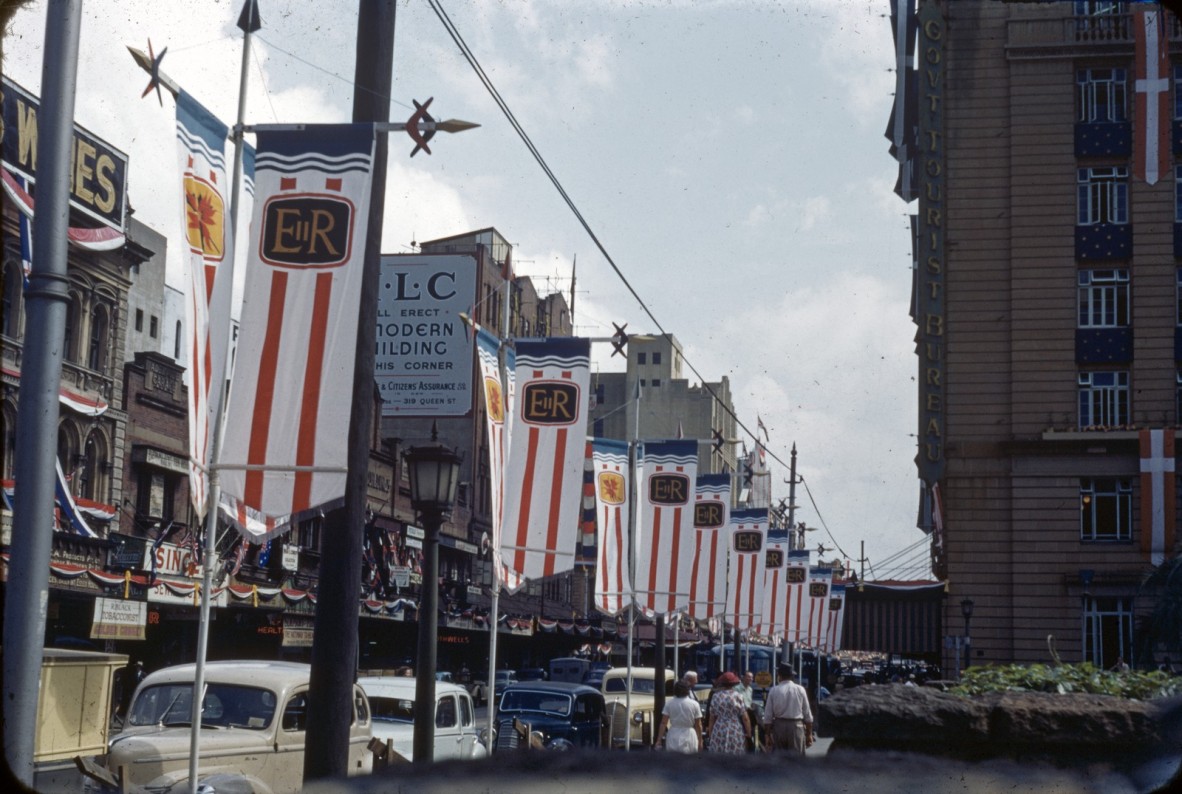 A colour slide image of the highly decorated streets in Brisbane during the 1954 Royal tour of Queensland by Her Majesty Queen Elizabeth II