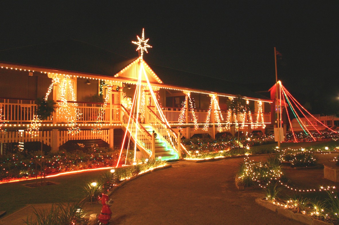 Large queenslander home lit up with christmas lights 