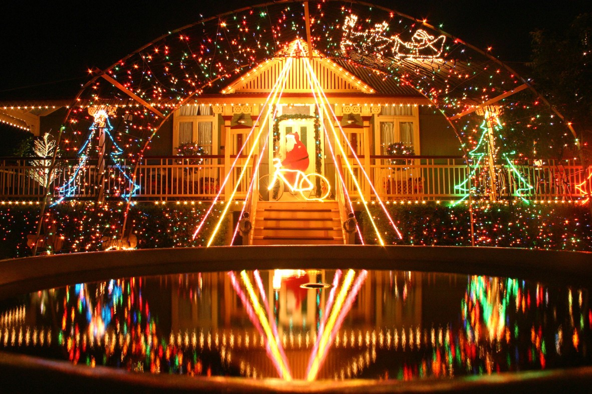 Christmas lights reflected off a fountain at a house in Sherwood