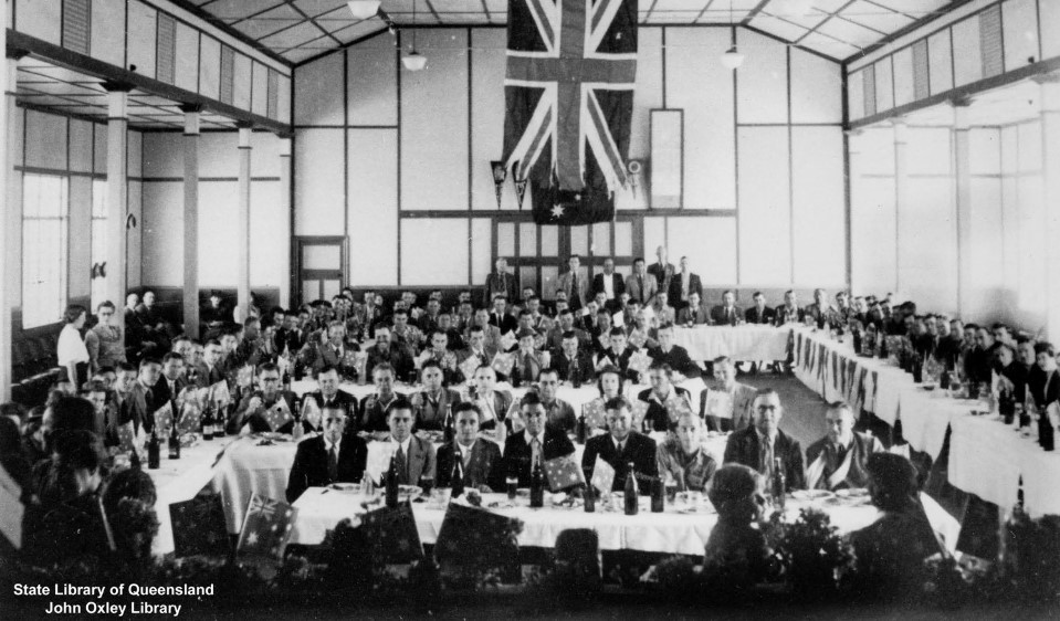 B&W image of official gathering of men and women after World War Two at Blackall