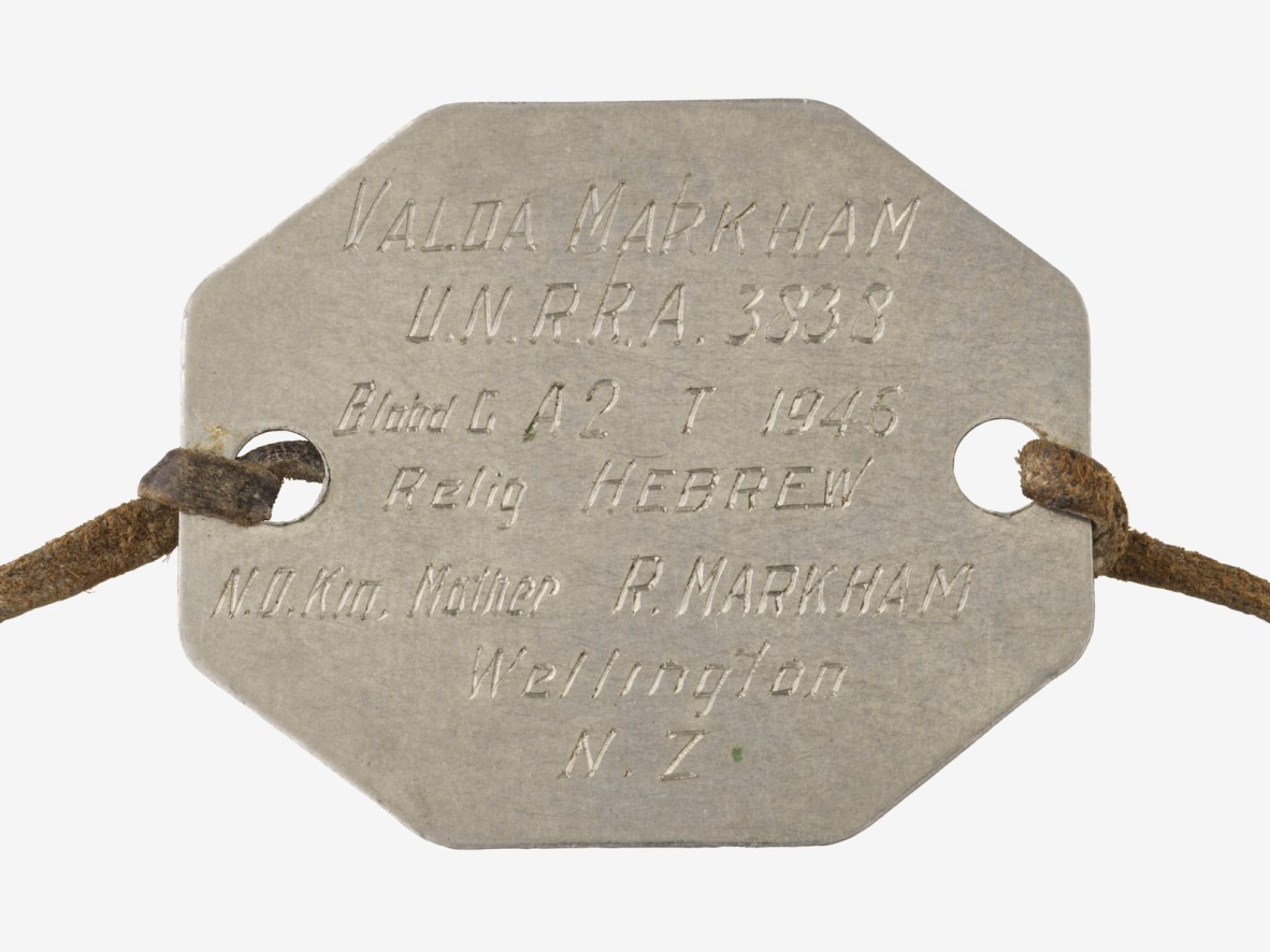 A hexagonal metal identity disc.