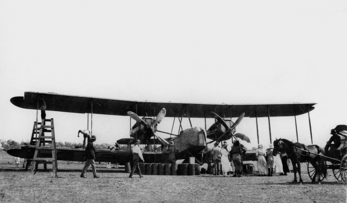 Early Vickers Vimy biplane, next to fuel tanks at the airfield, 1919.