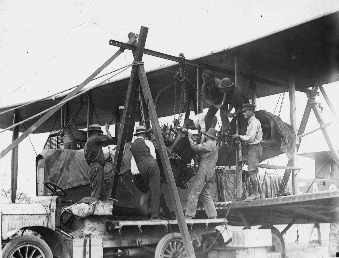 Mechanics installing an engine into a Vickers Vimy biplane bomber G-EAOU.