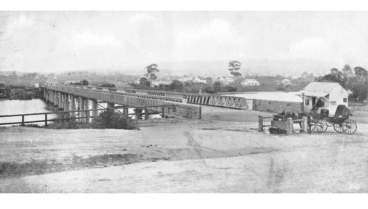 Photograph from 1874, showing the recently completed Victoria Bridge, with a horse-drawn coach in the foreground. 