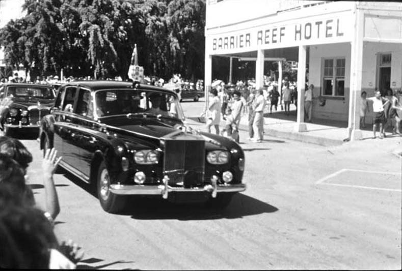 Her Majesty Queen Elizabeth II passes the Barrier Reef Hotel in a Rolls Royce 1970 