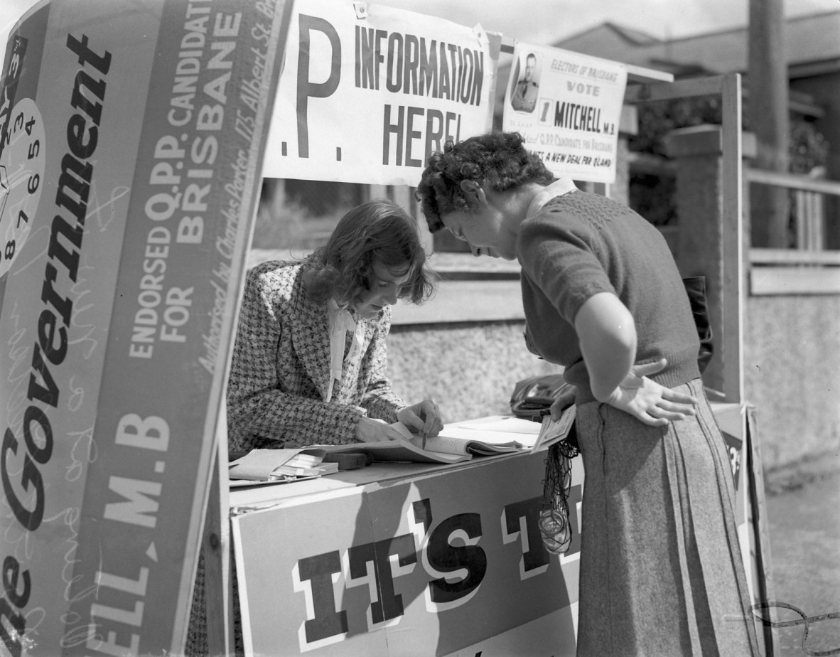 Two women at a voting booth